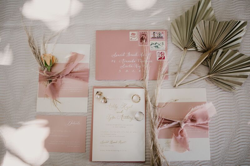 Custom blush colored wedding invitation suite for a beach Boho wedding on Siesta key