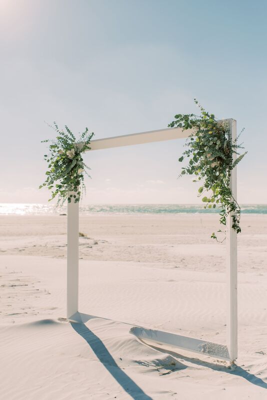 simple white wedding structure on Siesta Key for a beach wedding