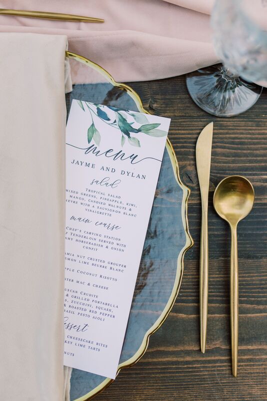 Sunset Beach Resort wedding reception with custom menu card, gold flatware and vintage glass accents
