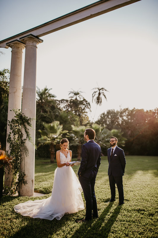 bride and groom exchanging wedding vows  on Duchene Lawn at Marie Selby Botanical Gardens
