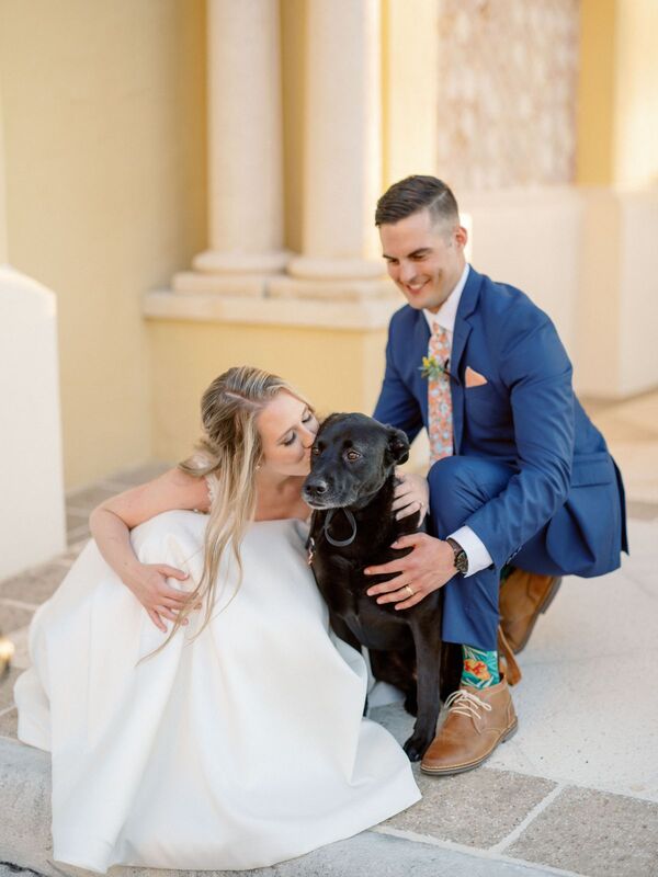 bride and groom with their dog at the Addison in Boca Raton