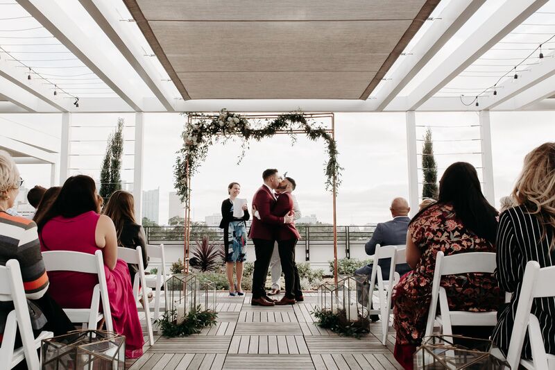 Tampa Wedding – Rooftop 220 – Armature Works- Jennifer Matteo Event Planning – Armature Works Wedding – Tampa wedding planner – Tampa LGBTQ wedding - rooftop wedding ceremony - two grooms