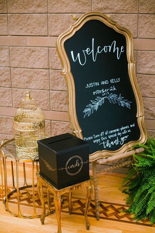 black and gold wedding card box, bird cage and chalk board welcome sign