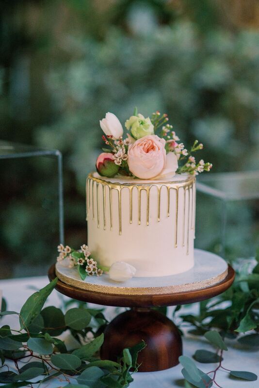 Gold drip wedding cake for an intimate wedding reception