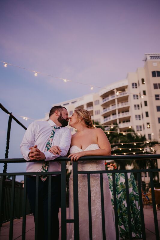 bride and groom kissing under the stars at their Ritz Carlton Beach Club wedding