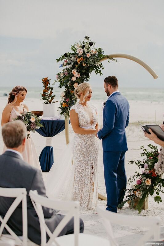 Bride and Groom exchanging wedding vows at their Sunset Beach Resort wedding on Siesta Key