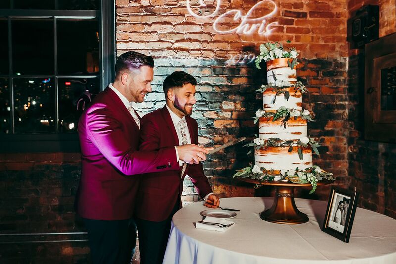 Tampa Wedding – Rooftop 220 – Armature Works- Jennifer Matteo Event Planning – Armature Works Wedding – Tampa wedding planner – Tampa LGBTQ wedding - two grooms - two grooms cutting cake