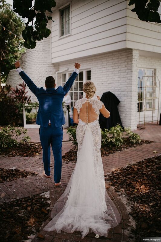 Groom cheering at the end of his Siesta key wedding ceremony