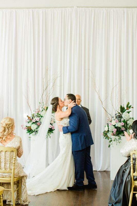 bride and groom sealing their wedding vows with a kiss at The Orlo in Tampa