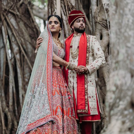 South Asian bride and groom posing for wedding portraits at the Ringling