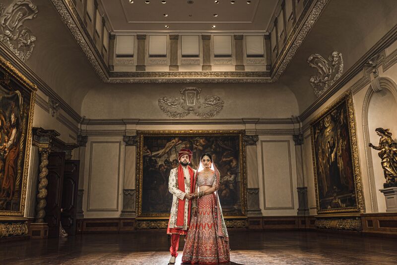South Asian bride and groom inside a gallery at The Ringling Museum