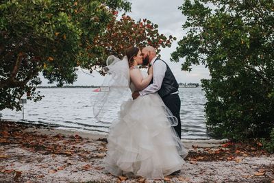 Jennifer Matteo Event Planning – Sarasota Wedding Planner- Mote Marine Laboratory – Longboat Island Chapel  - Florida Luxury Wedding Planner - bride and groom at Sarasota Bay