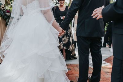 Jennifer Matteo Event Planning – Sarasota Wedding Planner- Mote Marine Laboratory – Longboat Island Chapel  - Florida Luxury Wedding Planner - bride and groom holding hands