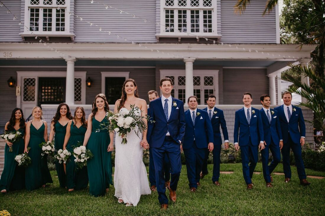 Bride, Groom and wedding party on the front lawn of The Orlo in Tampa