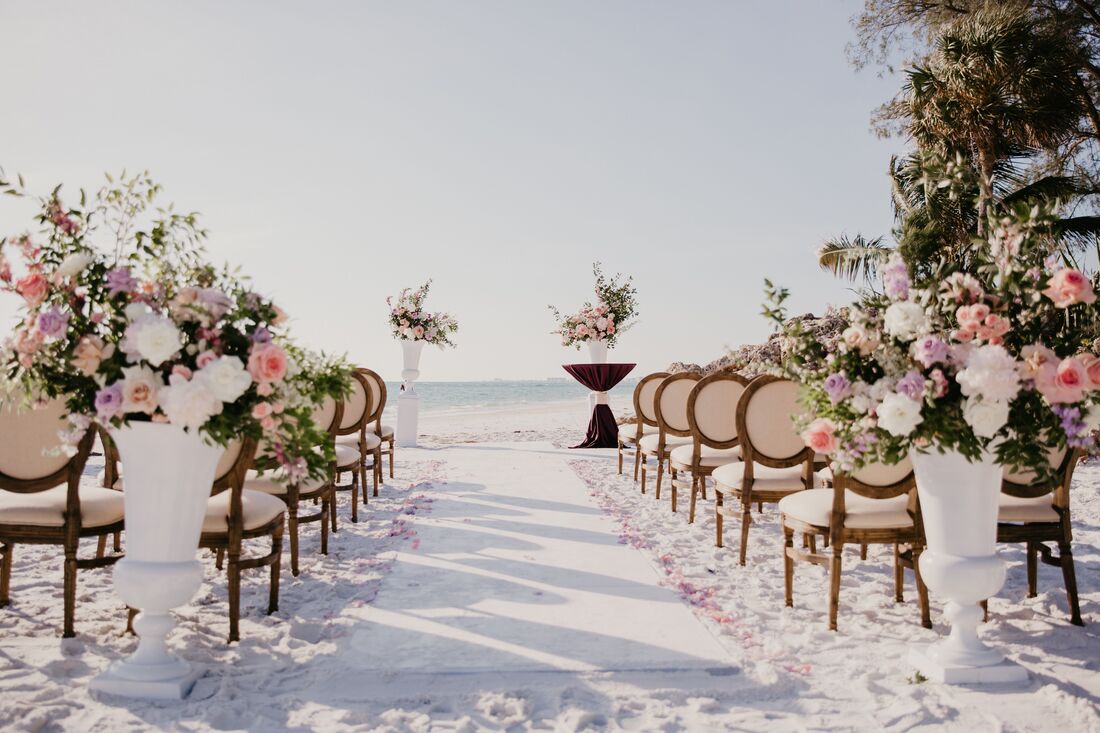 An intimate siesta key beach wedding with luxurious floral designs