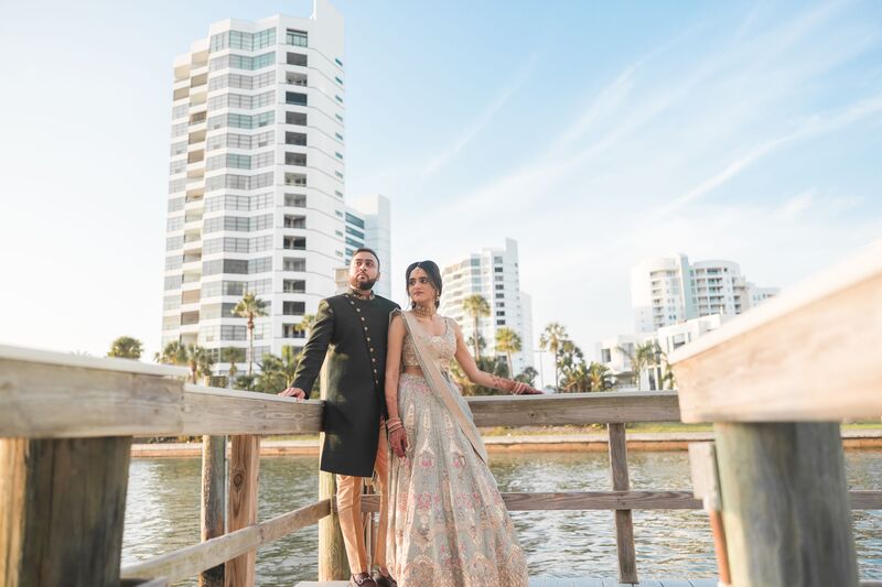 South Asian bride and groom on the dock of the Ritz Carlton Sarasota beofre their Sangeet