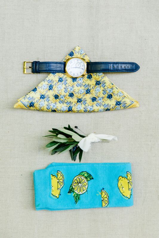 groom's accessories for an Amalfi Coast themed wedding including bright blue socks with lemons