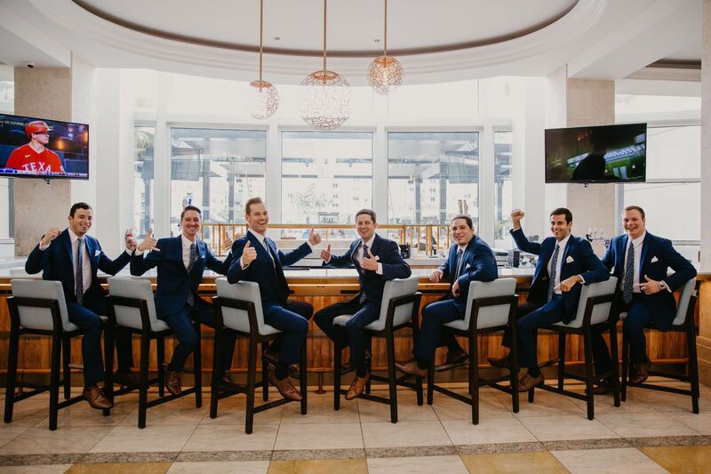 Groom and wedding party at the bar in the Marriott Water street in Tampa