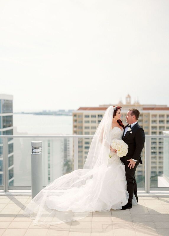 bride and groom embracing for the first time after their first look on the rooftop of the Westin Sarasota