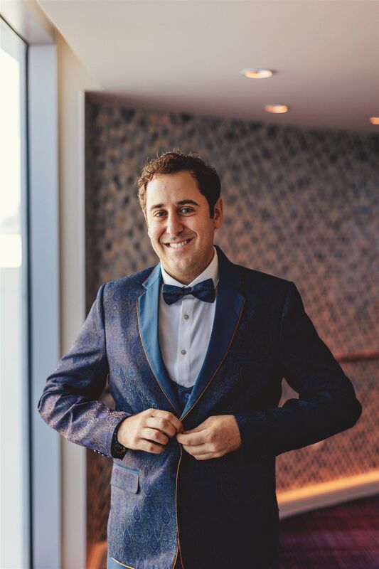 smiling clearwater groom in a blue patterned tuxedo