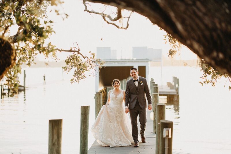 Bay Preserve at Osprey -Bay Preserve wedding – Sarasota wedding – Sarasota wedding planner – Sarasota luxury wedding planner - bride- groom - bride and groom - bride and groom walking on dock - wide and groom at Sarasota Bay