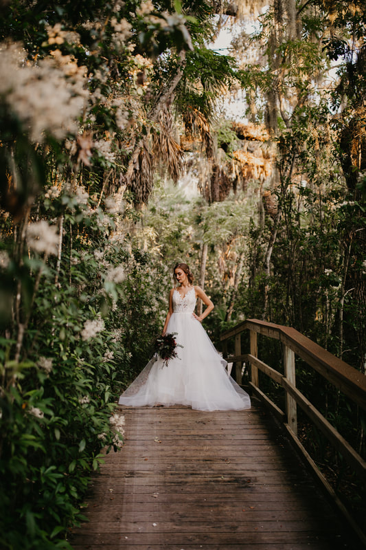 bride on a boardwalk in Historic Spanish Point