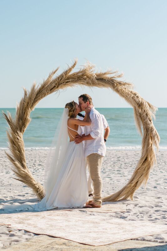 Jennifer Matteo Event Planning – Sarasota wedding planner- Longboat Key wedding – Sarasota boho wedding – Florida beach wedding – bohemian chic wedding – Sarasota luxury wedding planner -- first kiss