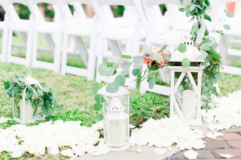 Jennifer Matteo Event Planning -Saint Petersburg wedding – Vinoy wedding - Vinoy outdoor wedding ceremony - white garden chairs - white lanterns - white wedding decor