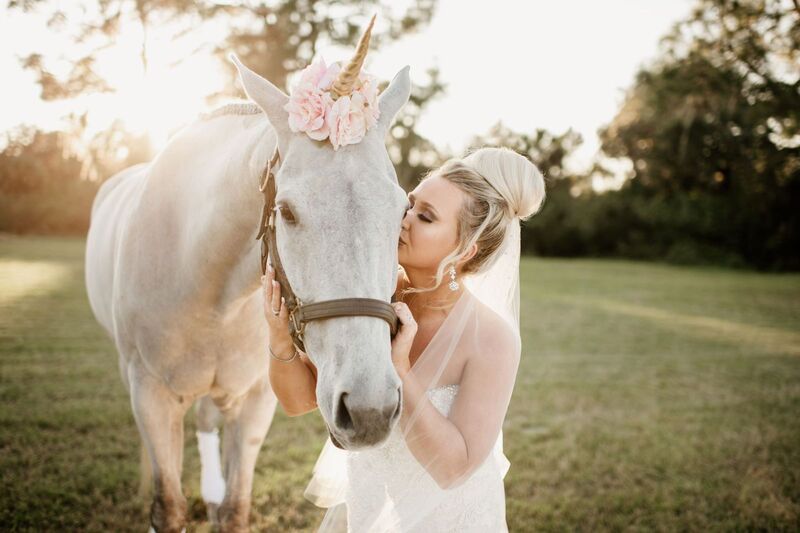 bride with her unicorn during her wedding inspired by The Unicorn in Captivity
