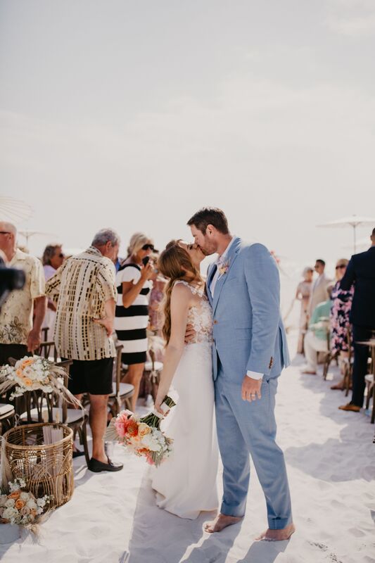 bride and groom kissing after their Siesta Key beach wedding ceremony