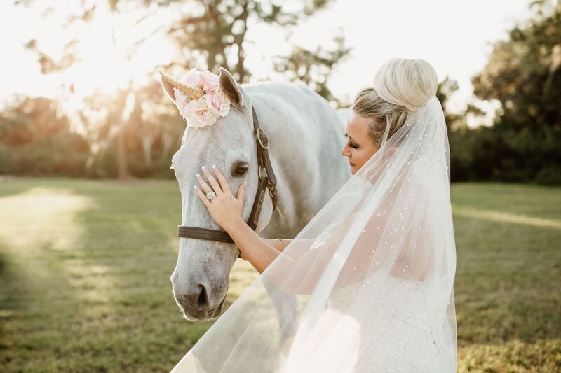 bride with her unicorn during her wedding inspired by The Unicorn in Captivity
