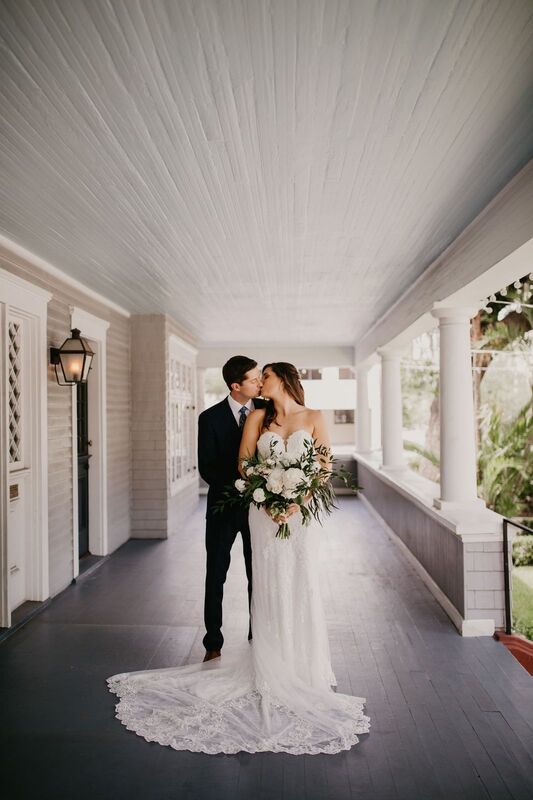 Bride and groom on the front porch of The Orlo in Tampa
