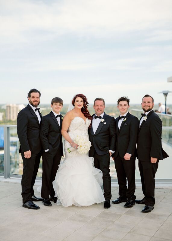 bride, groom and groomsmen on the rooftop of the Westin Sarasota
