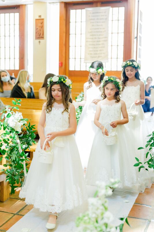 Flower girls at with flower crowns at at wedding at St. Lawrence Catholic Church in Tampa