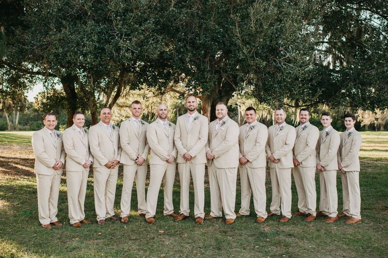 grooming groomsmen wearing tan suits at a Venice Florida wedding