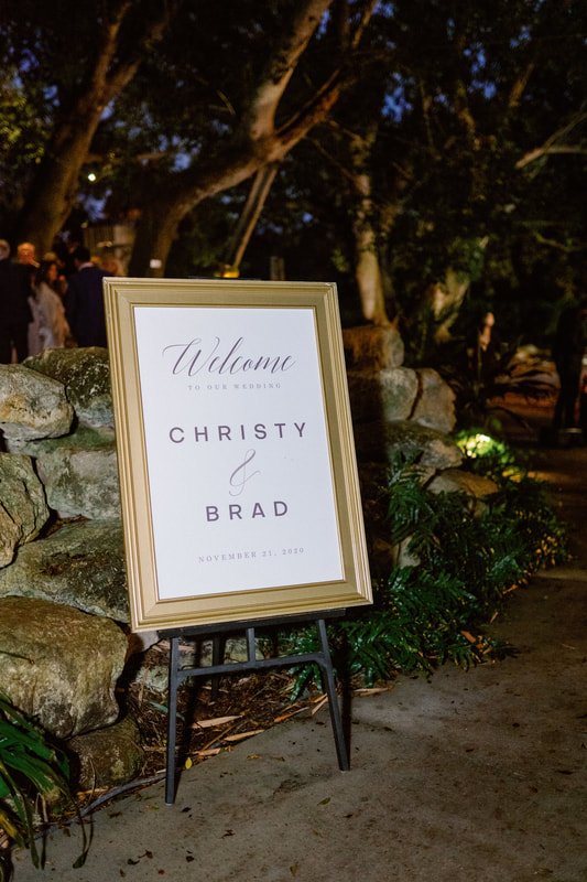 Gold framed welcome sign at Selby Gardens wedding reception