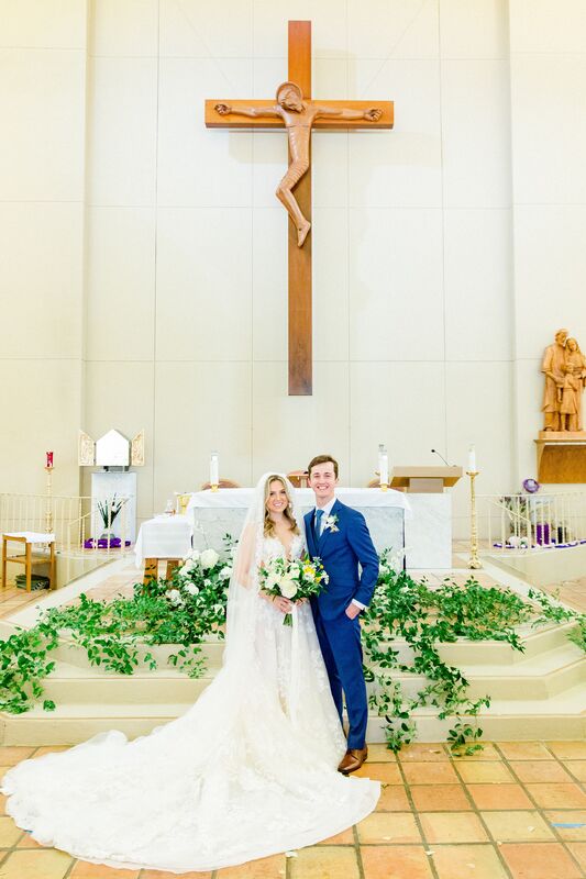bride and groom on the altar at St. Lawrence Catholic Church in Tampa
