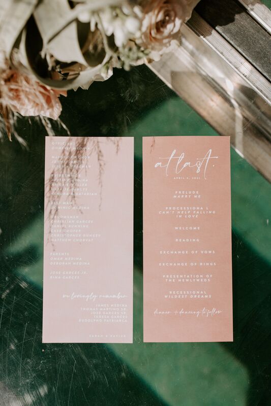 Elegant custom wedding program in neutral tones with white lettering