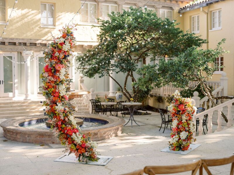 floral wedding structure in from of a fountain at the Addison in Boca Raton