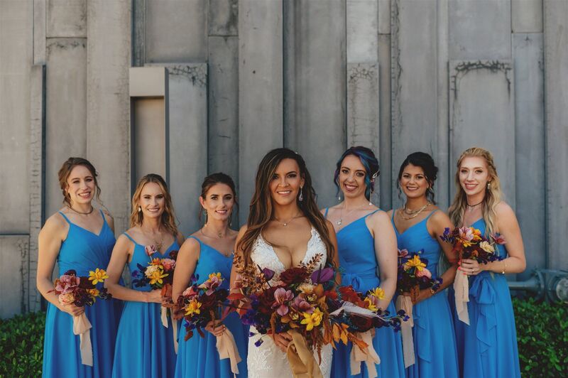 bride with bridesmaids in beautiful blue gowns