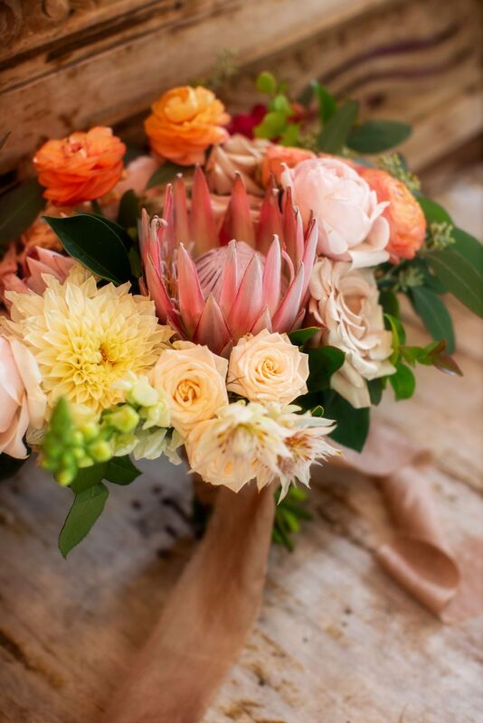 textured protea and rose boho inspired bridal bouquet
