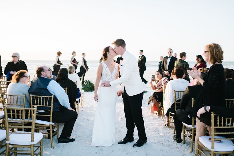 Jennifer Matteo Event Planning  - Pass A Grille wedding – Red Mesa Cantina wedding reception – Tropical wedding – St Petersburg wedding -
just married- first kiss- bride and groom at beach wedding ceremony