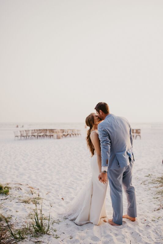 Bride and groom kissing on Siesta Key beach