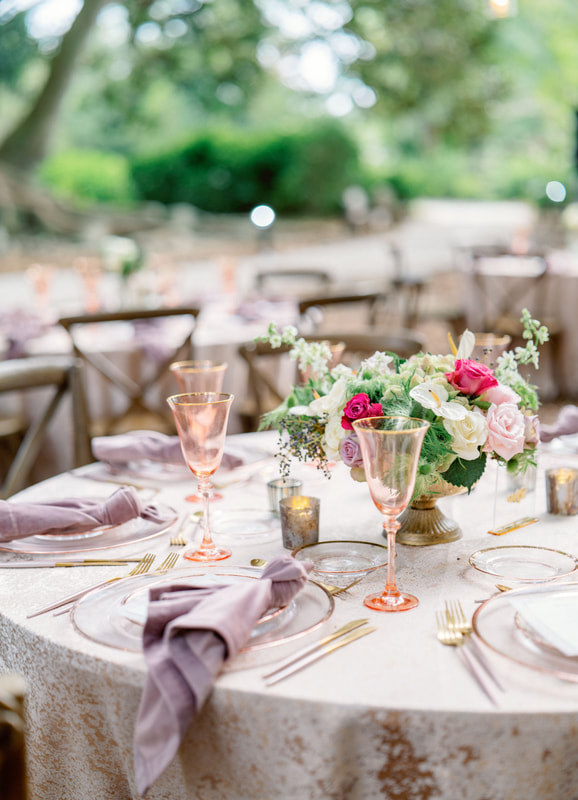 luxurious wedding reception set with pink vintage glassware