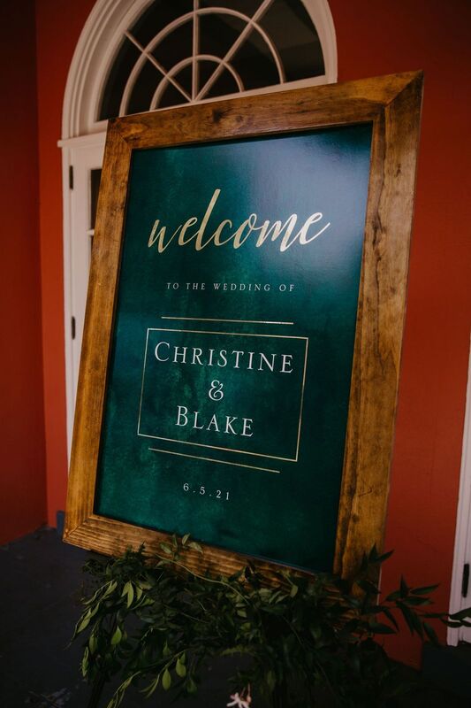 Custom hunter green and gold Welcome sign at a Tampa wedding