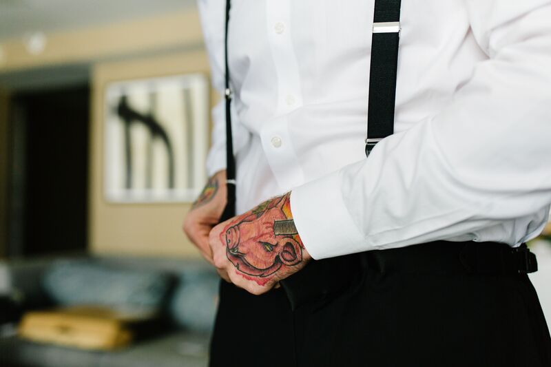 Jennifer Matteo Event Planning  - Pass A Grille wedding – Red Mesa Cantina wedding reception – Tropical wedding – St Petersburg wedding -
groom getting dressed - groom with tattoos 
