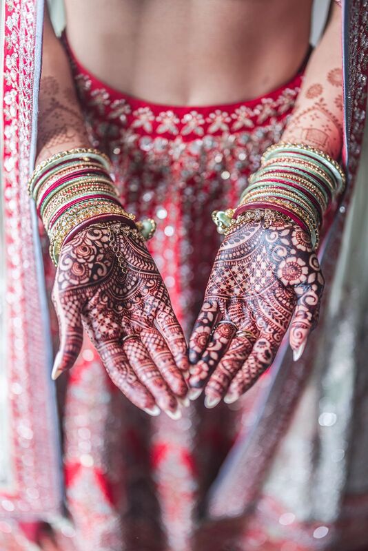 Beautiful henna adorning a South Asian brides hands beofre her Sarasota wedding