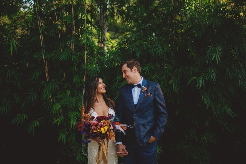 bride and groom in a grove of bamboo