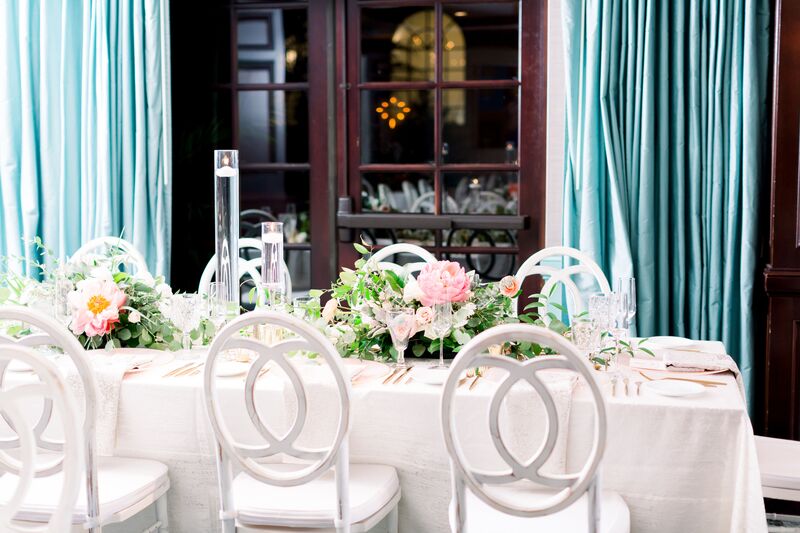 Jennifer Matteo Event Planning -Saint Petersburg wedding – Vinoy wedding - Vinoy wedding reception  - white infinity chairs - pink and white centerpieces - floating candles 
