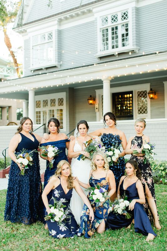 bride with bridal party in. blue floral dresses at the Orlo 
